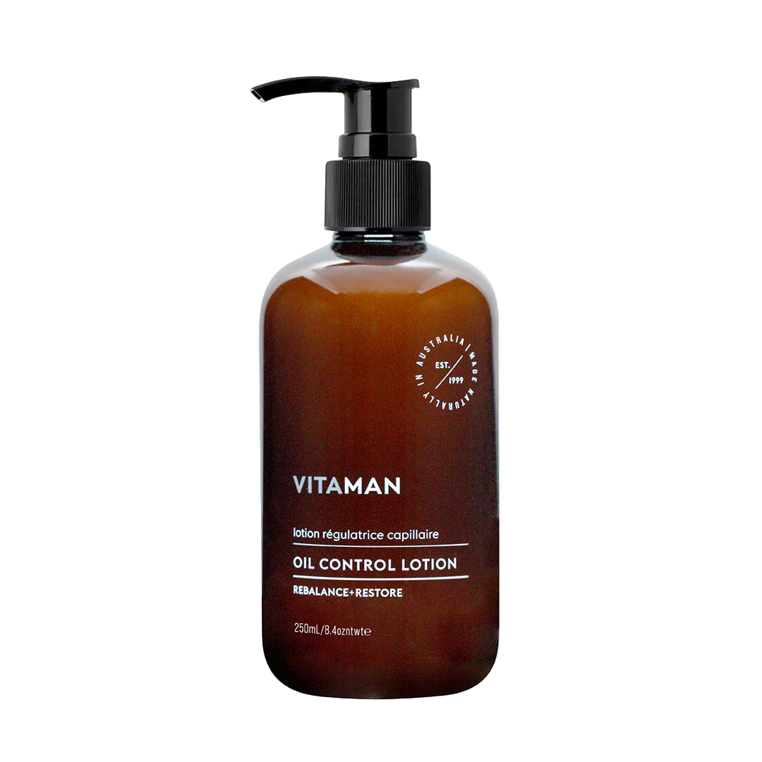 Brown bottle of Vitaman oil control lotion with pump background
