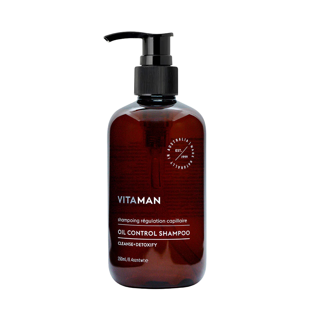 Brown shampoo bottle with pump labeled 'VITAMAN'
