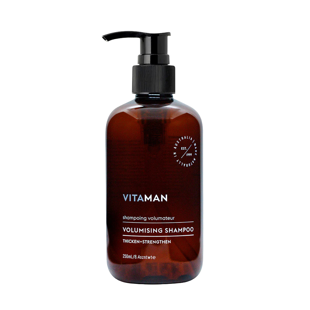 Brown shampoo bottle with pump labeled 'VITAMAN Volumising Shampoo'