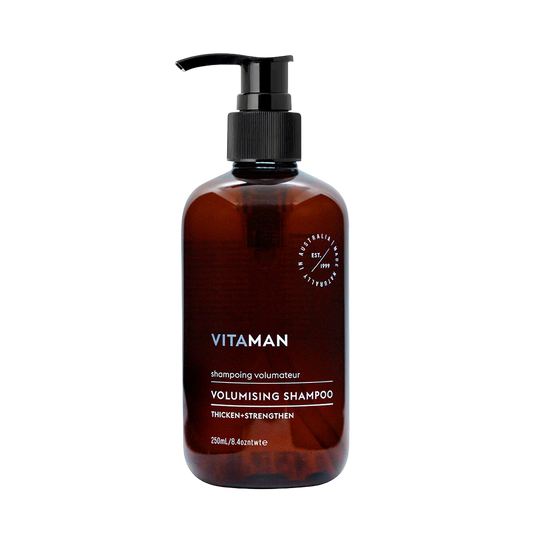 Brown shampoo bottle with pump labeled 'VITAMAN Volumising Shampoo'